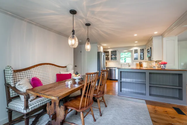 a dinning room dining table and chairs