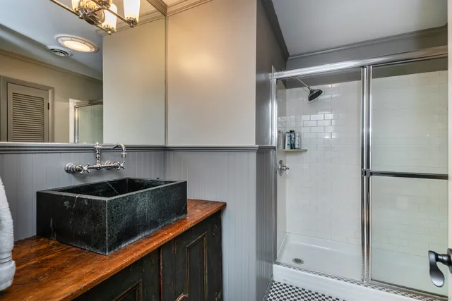 a view of a sink storage and utility room with wooden floor