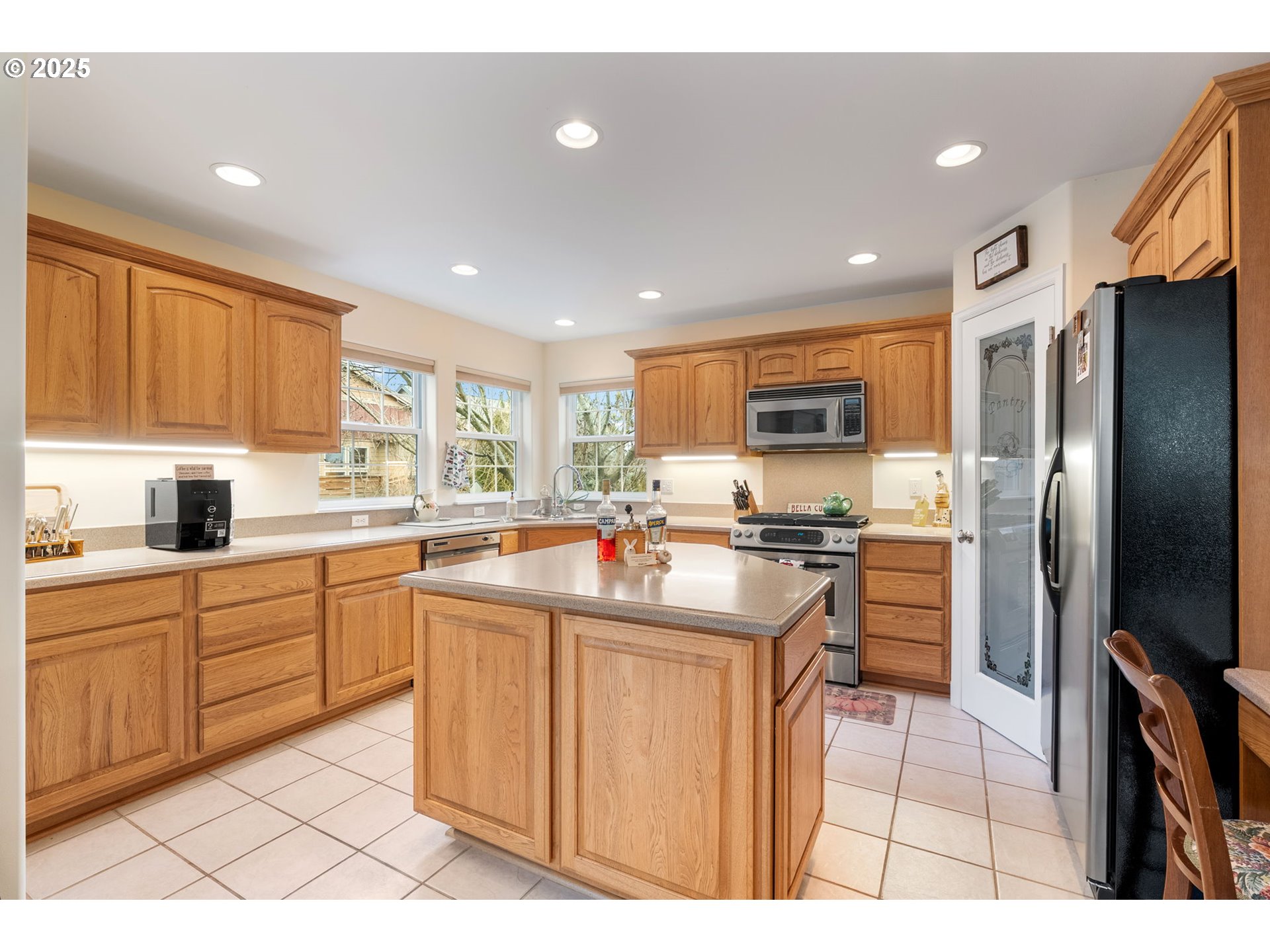 948 28th Street Hood River, OR 97031 - Photo 11 of 46 a kitchen with stainless steel appliances granite countertop a refrigerator and a stove top oven