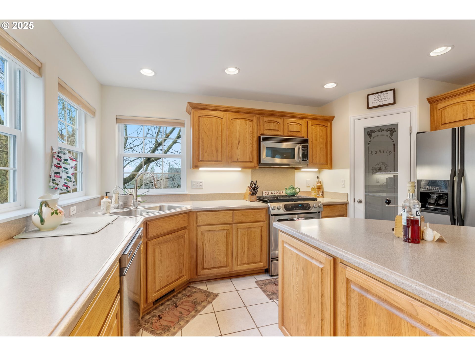 948 28th Street Hood River, OR 97031 - Photo 12 of 46 a kitchen with stainless steel appliances granite countertop a sink stove and refrigerator
