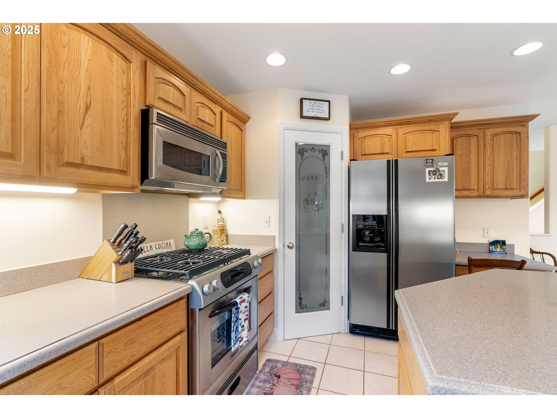 948 28th Street Hood River, OR 97031 - Photo 13 of 46 a kitchen with stainless steel appliances granite countertop a refrigerator a stove a sink and a microwave