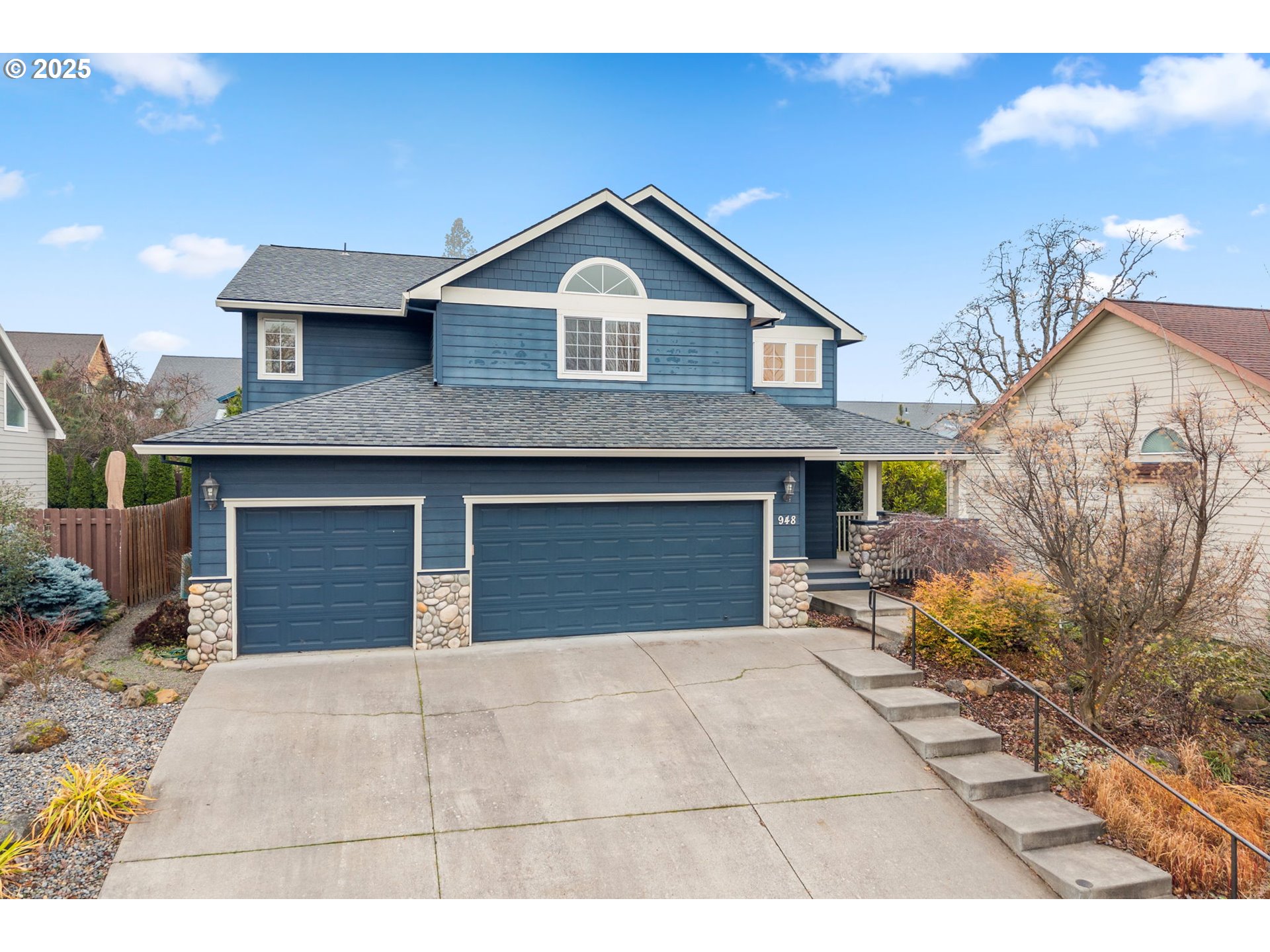 948 28th Street Hood River, OR 97031 - Photo 43 of 46 a front view of a house with a yard and garage