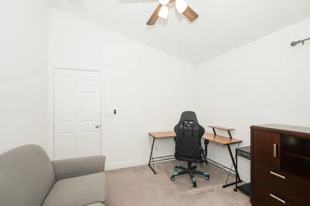 a view of a workspace with furniture