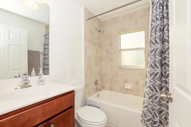 a bathroom with a sink a toilet and a bathtub