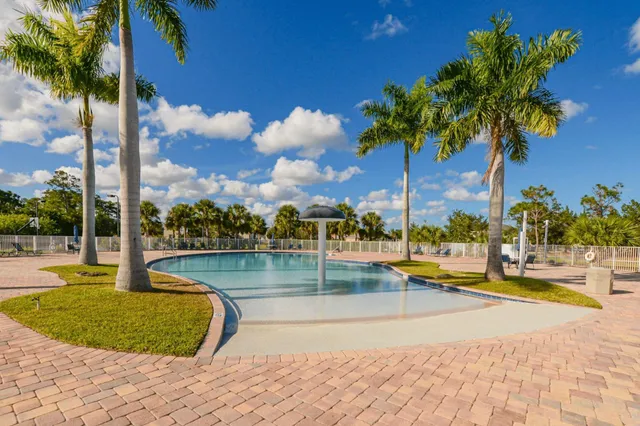a view of a swimming pool with an outdoor seating