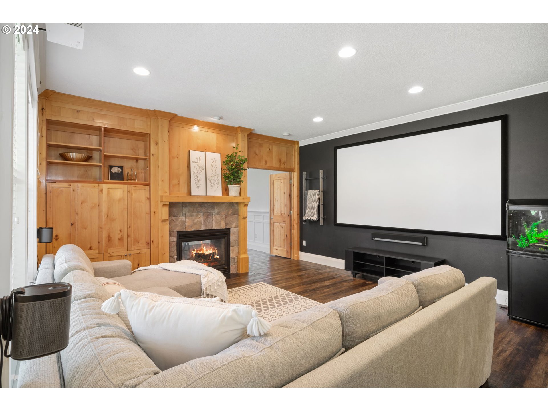 29090 Southeast Powell Valley Road Gresham, OR 97080 - Photo 15 of 45 a living room with fireplace furniture and a projector