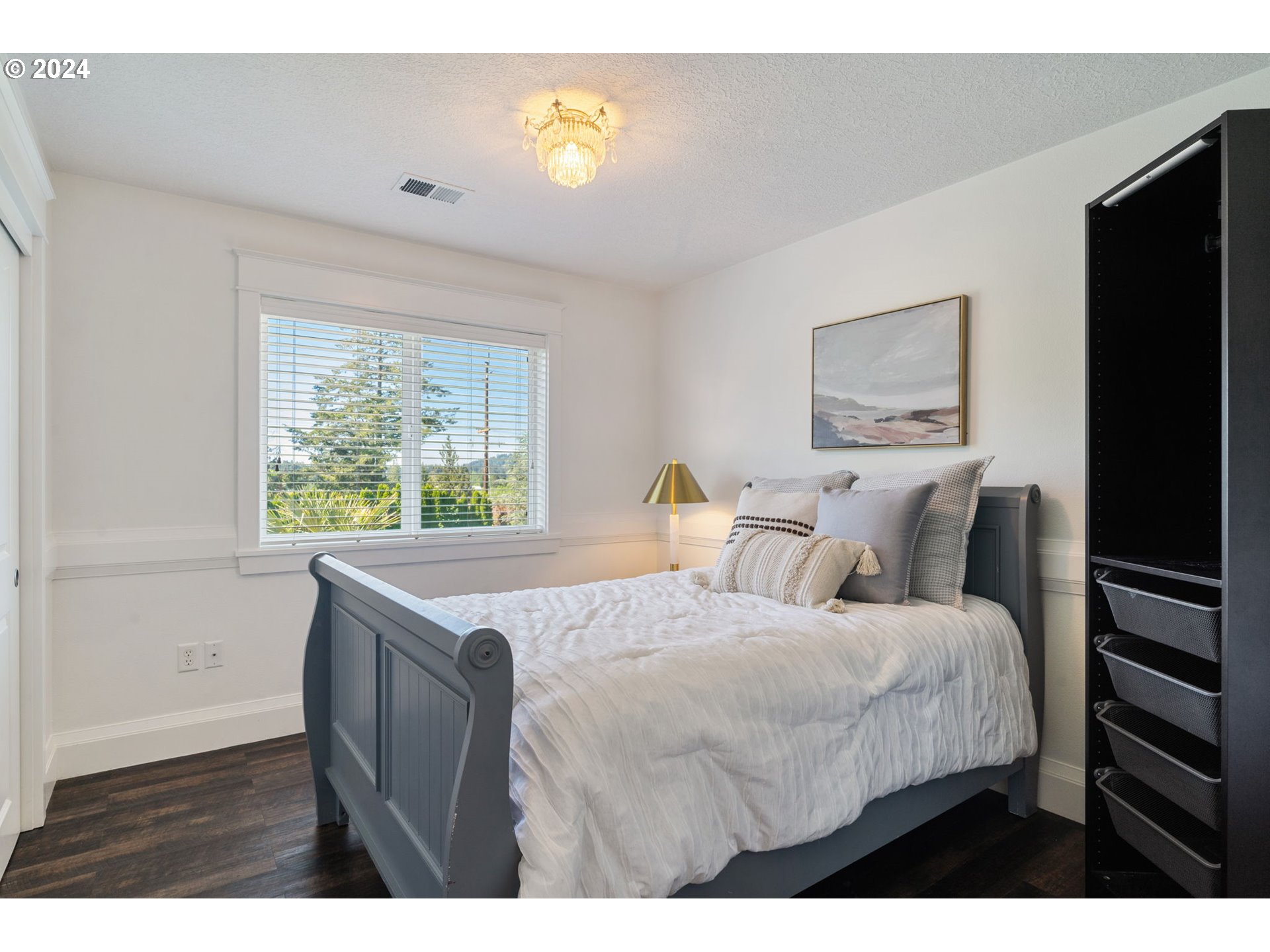 29090 Southeast Powell Valley Road Gresham, OR 97080 - Photo 29 of 45 a bedroom with a bed and a painting on the wall