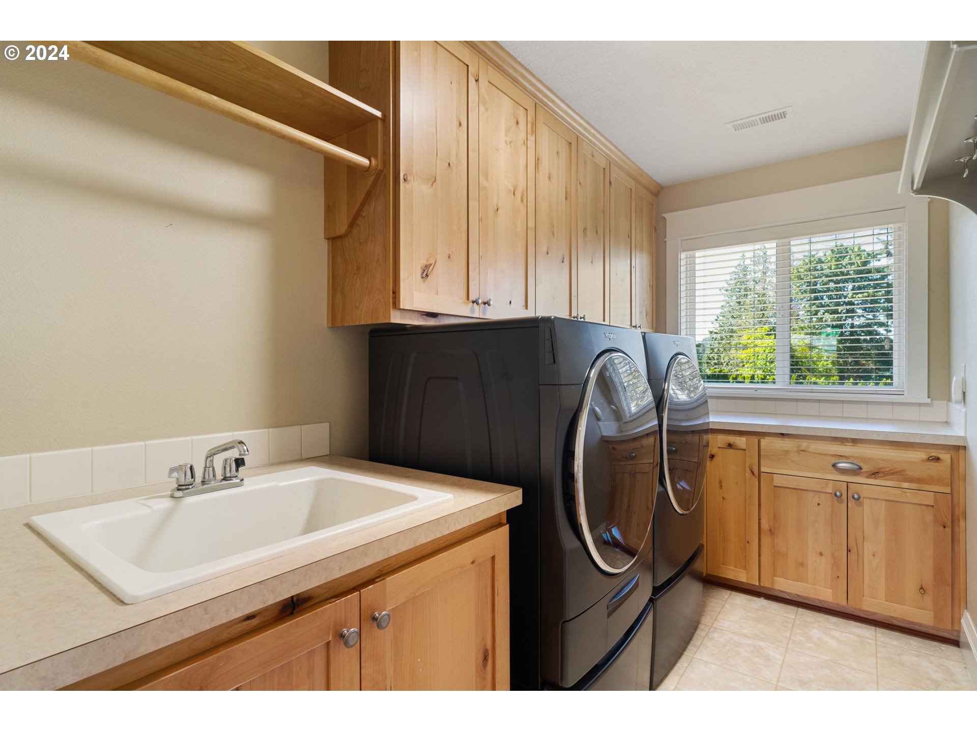 29090 Southeast Powell Valley Road Gresham, OR 97080 - Photo 31 of 45 a utility room with a sink a washer and dryer