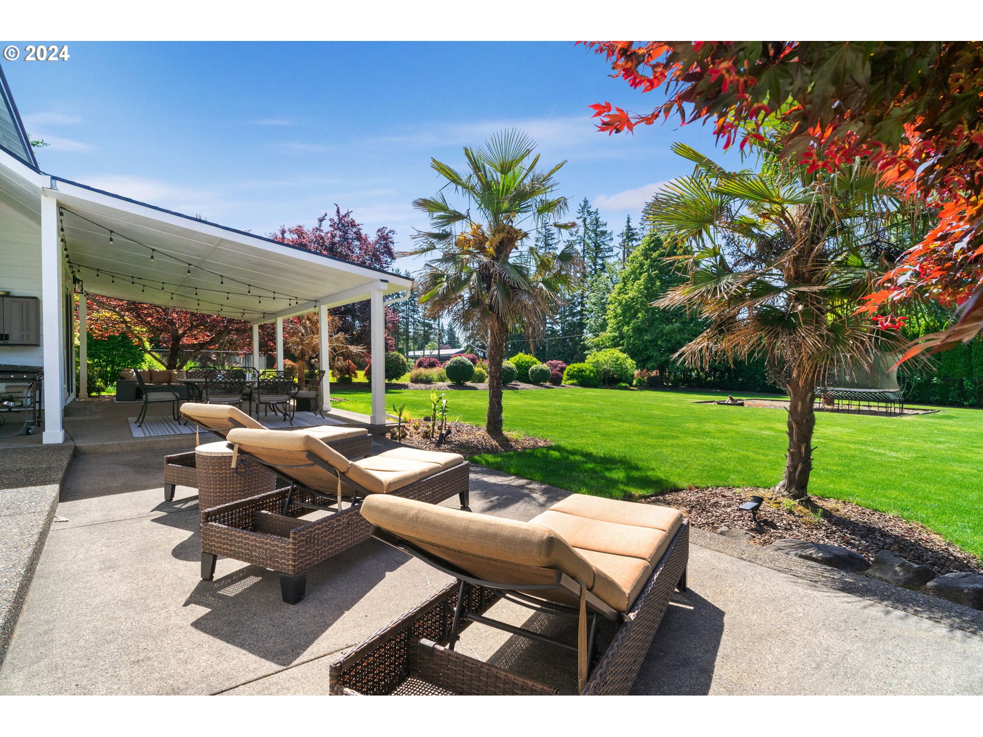 29090 Southeast Powell Valley Road Gresham, OR 97080 - Photo 37 of 45 a view of a patio with a table and chairs