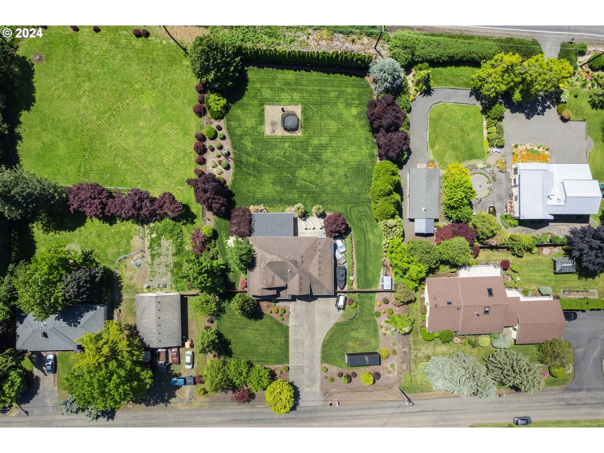 29090 Southeast Powell Valley Road Gresham, OR 97080 - Photo 43 of 45 an aerial view of a house with a yard lake lake house swimming pool and outdoor seating