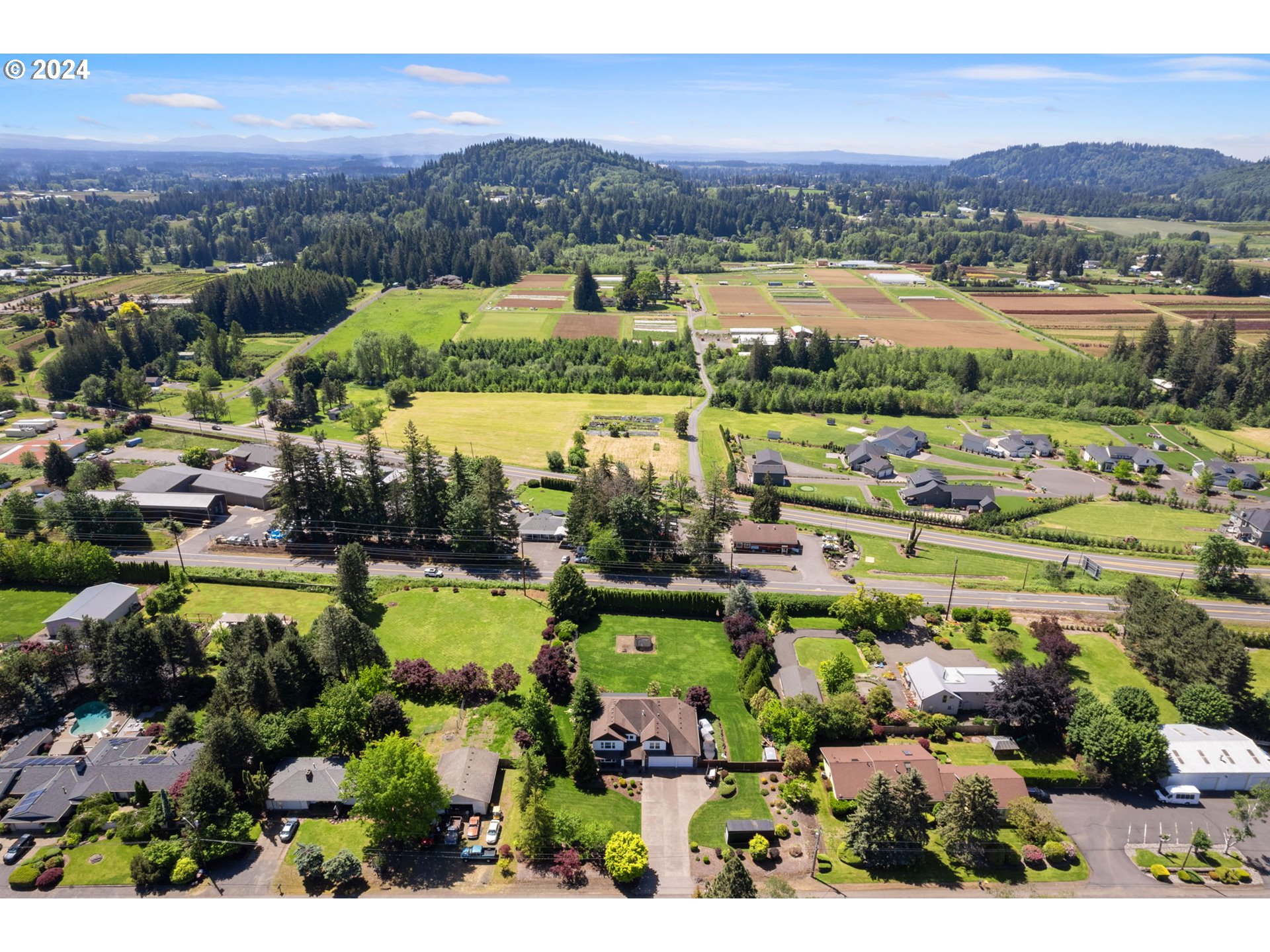 29090 Southeast Powell Valley Road Gresham, OR 97080 - Photo 45 of 45 an aerial view of a city with lots of residential buildings and mountain view in back