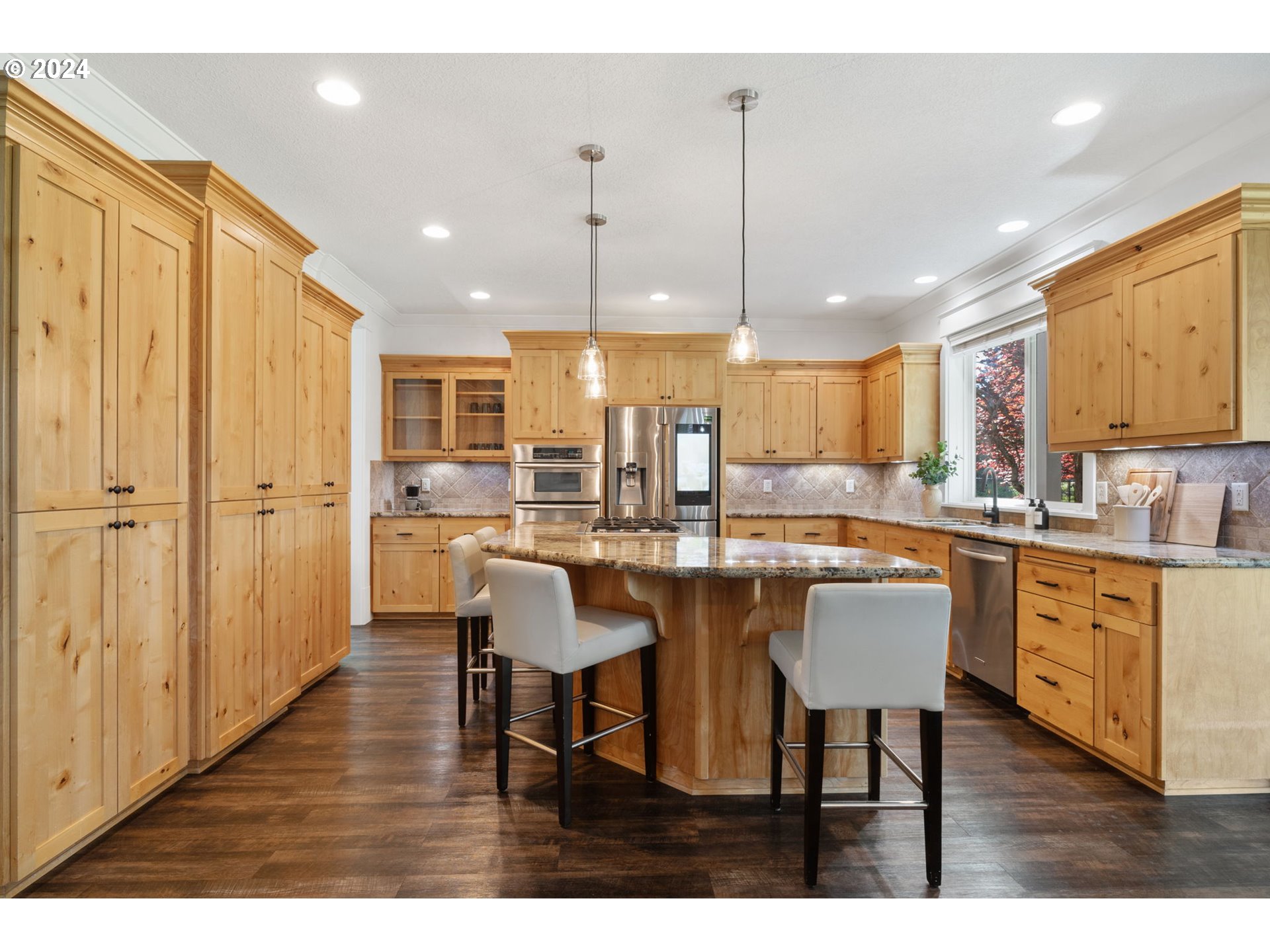 29090 Southeast Powell Valley Road Gresham, OR 97080 - Photo 9 of 45 a large kitchen with a table and chairs