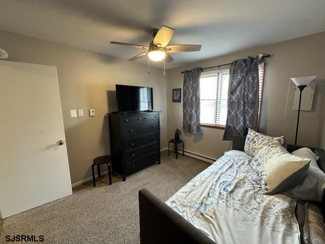 251 4th Street South, Unit 9 Brigantine, NJ 08203 - Photo 16 of 19 a bedroom with a bed and a television