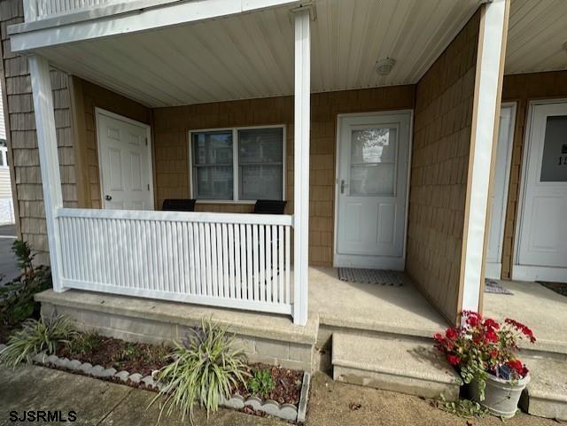 251 4th Street South, Unit 9 Brigantine, NJ 08203 - Photo 18 of 19 a view of a porch with a chair