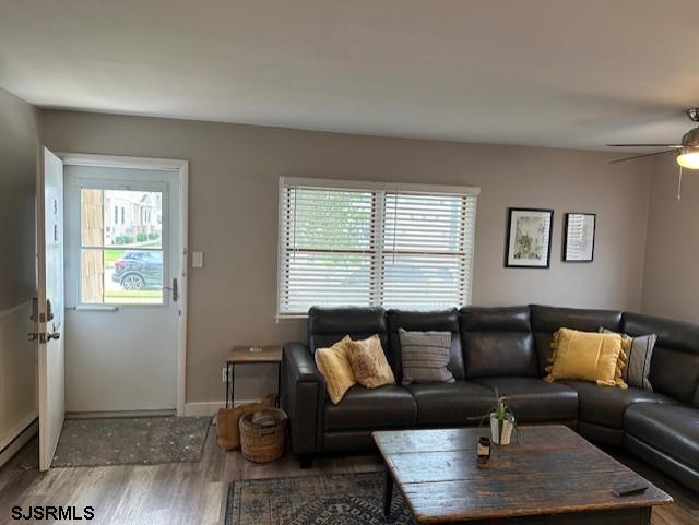 251 4th Street South, Unit 9 Brigantine, NJ 08203 - Photo 2 of 19 a living room with furniture and a window