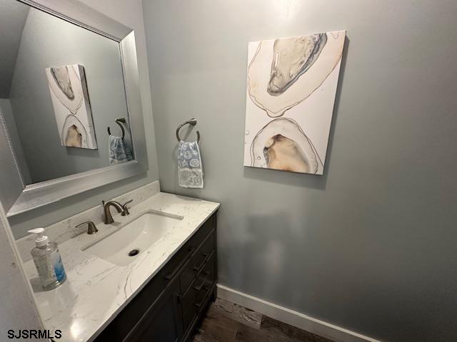 251 4th Street South, Unit 9 Brigantine, NJ 08203 - Photo 9 of 19 a bathroom with a sink and a mirror