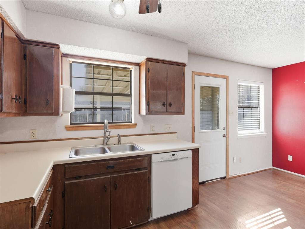 701 College Street Celeste, TX 75423 - Photo 13 of 29 a kitchen with a sink cabinets and window