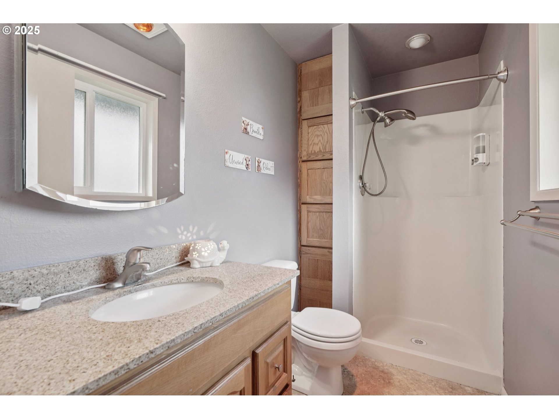 130 Stella Lane Longview, WA 98632 - Photo 21 of 41 a bathroom with a granite countertop sink toilet and shower