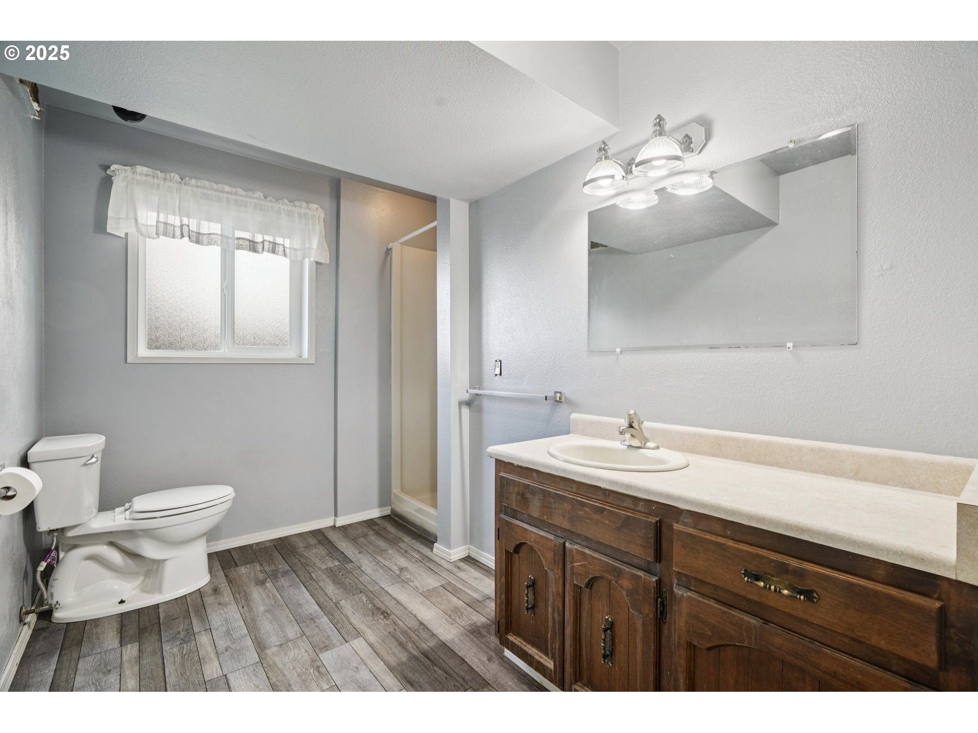 130 Stella Lane Longview, WA 98632 - Photo 32 of 41 a bathroom with a sink a toilet and a mirror