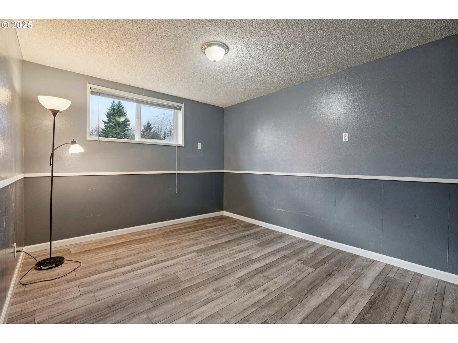 130 Stella Lane Longview, WA 98632 - Photo 34 of 41 a view of an empty room with wooden floor