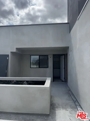 a view of a swimming pool with a table and chairs