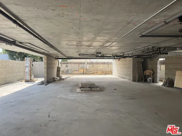 a room with windows and ceiling fan