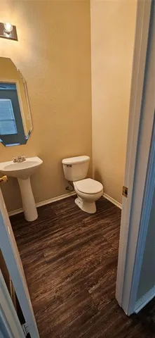 a bathroom with a toilet and a sink