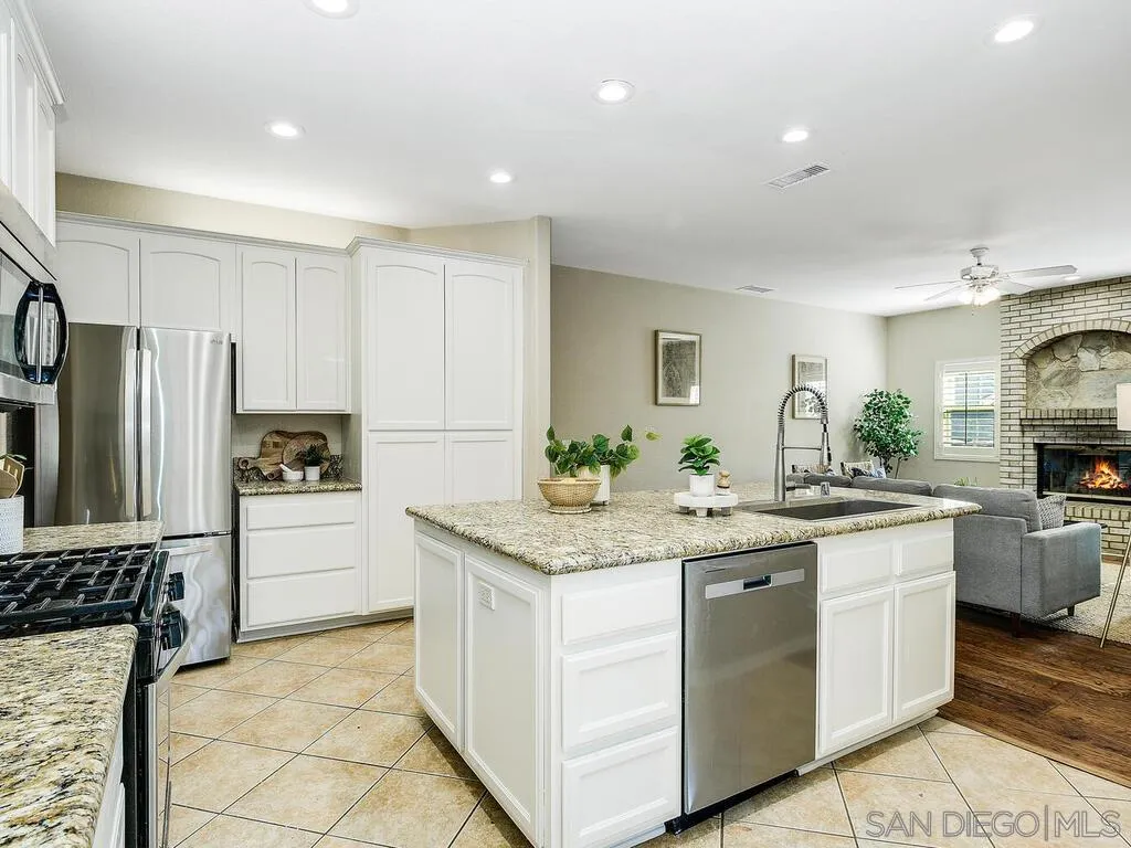 16304 Dartolo Road Ramona, CA 92065 - Photo 14 of 36 a kitchen with a sink stove and refrigerator