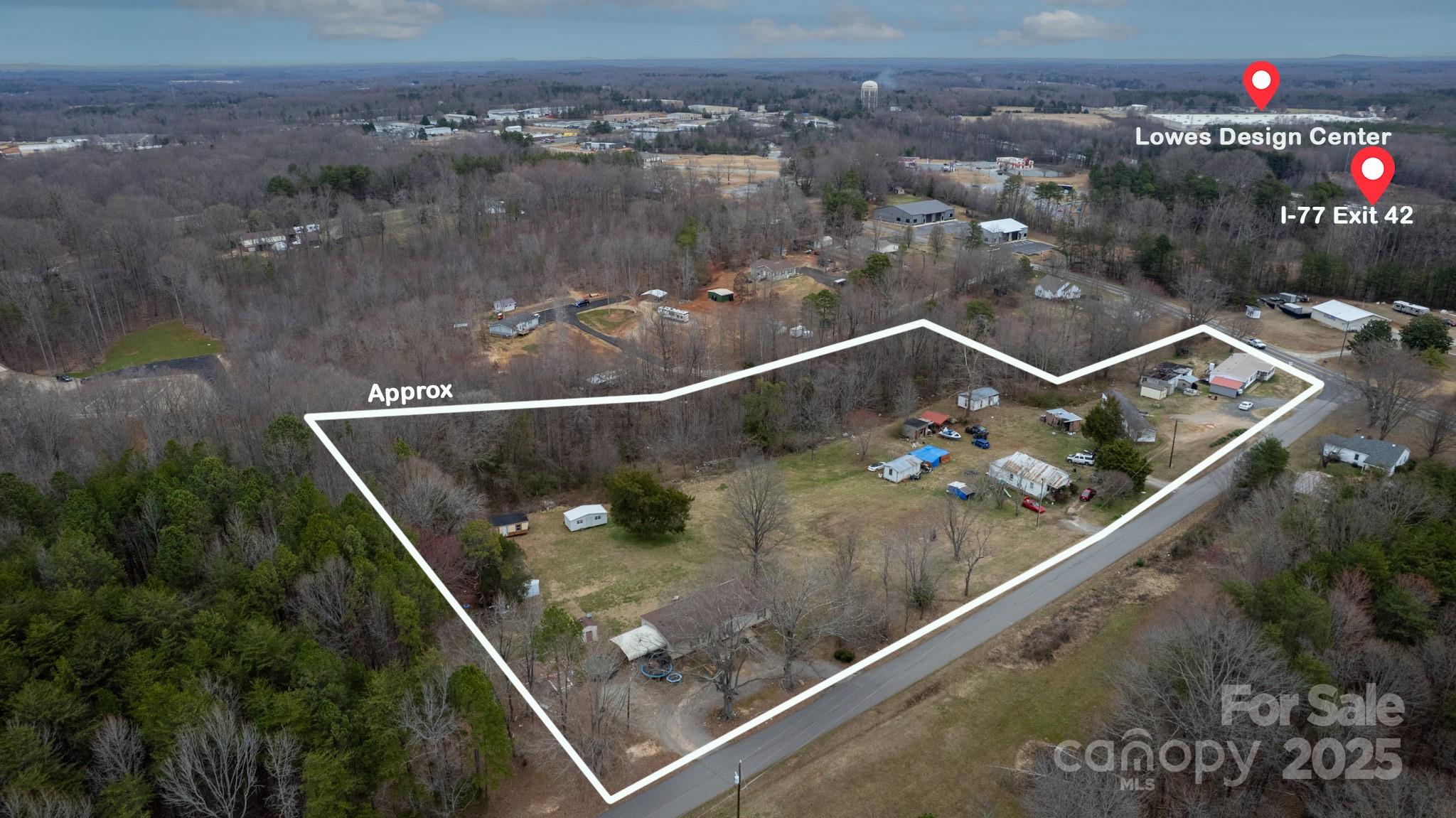 116 Lipe Road Troutman, NC 28166 - Photo 6 of 12 an aerial view of a residential houses with city view