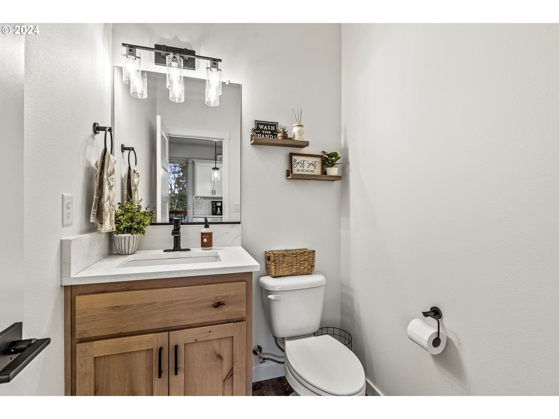 2033 North 2nd Way Ridgefield, WA 98642 - Photo 23 of 46 a bathroom with a sink vanity mirror and toilet