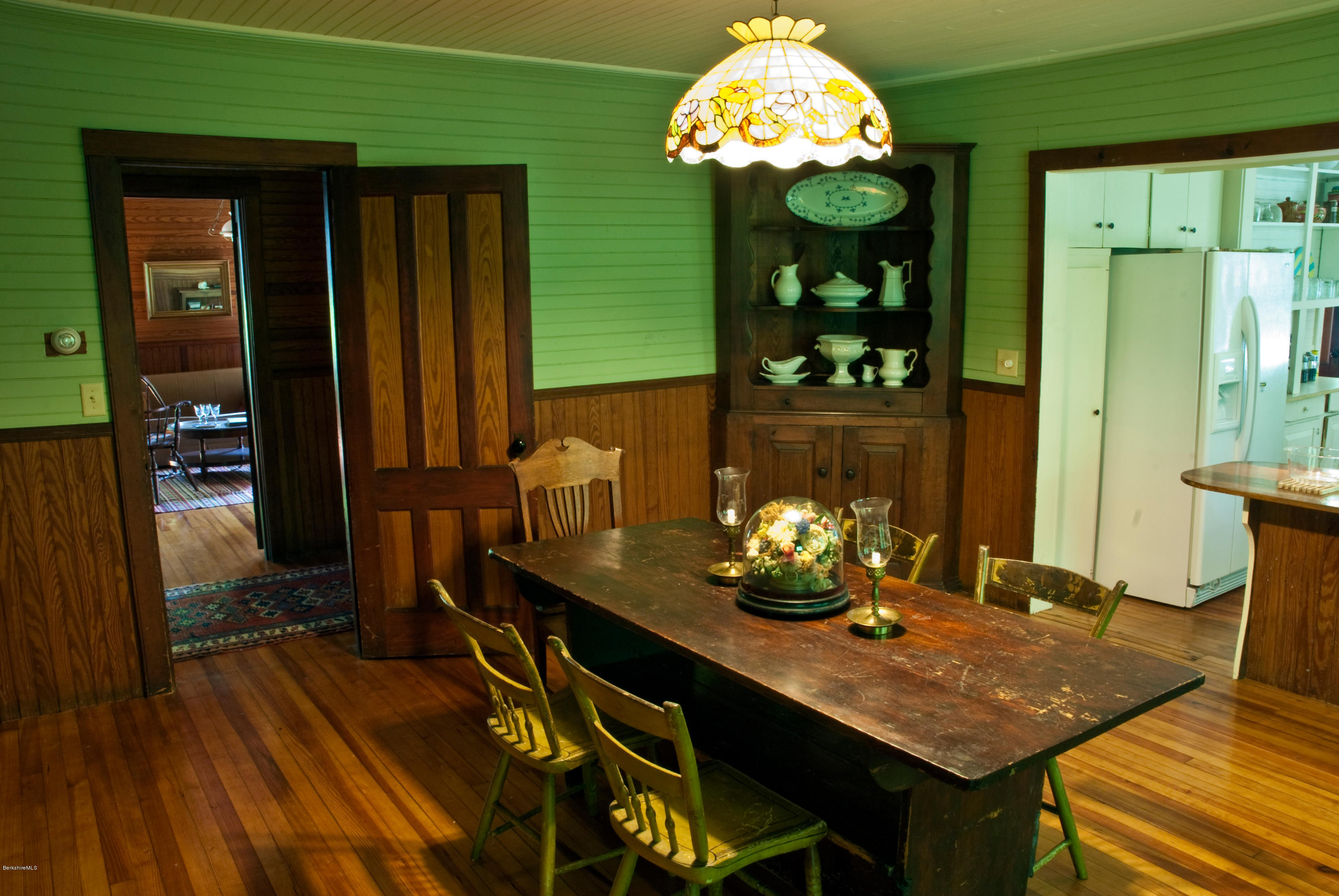 22 Bidwell Road Monterey, MA 01245 - Photo 20 of 46 a view of a dining room with furniture and chandelier
