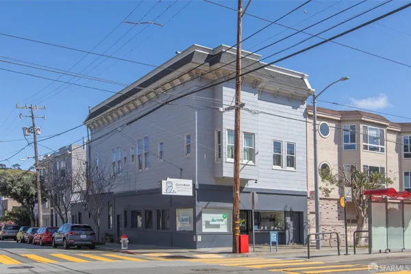 a view of a building with a street