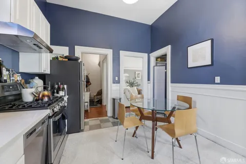 a kitchen with cabinets a sink and appliances
