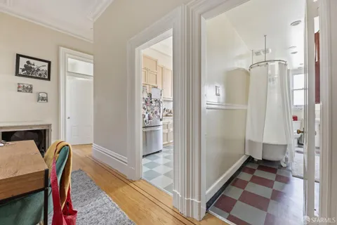 a view of a room with furniture and wooden floor