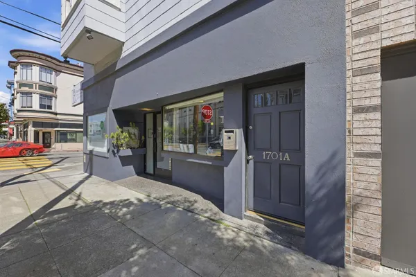 a kitchen with stainless steel appliances kitchen island granite countertop a refrigerator and a stove