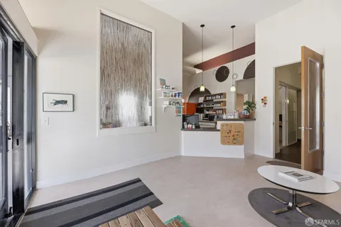 an entryway with wooden floor
