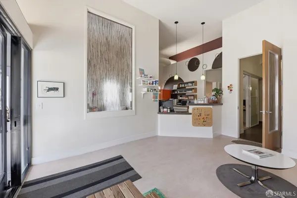 an entryway with wooden floor