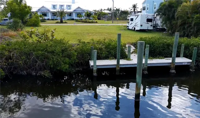 a view of a lake with a yard
