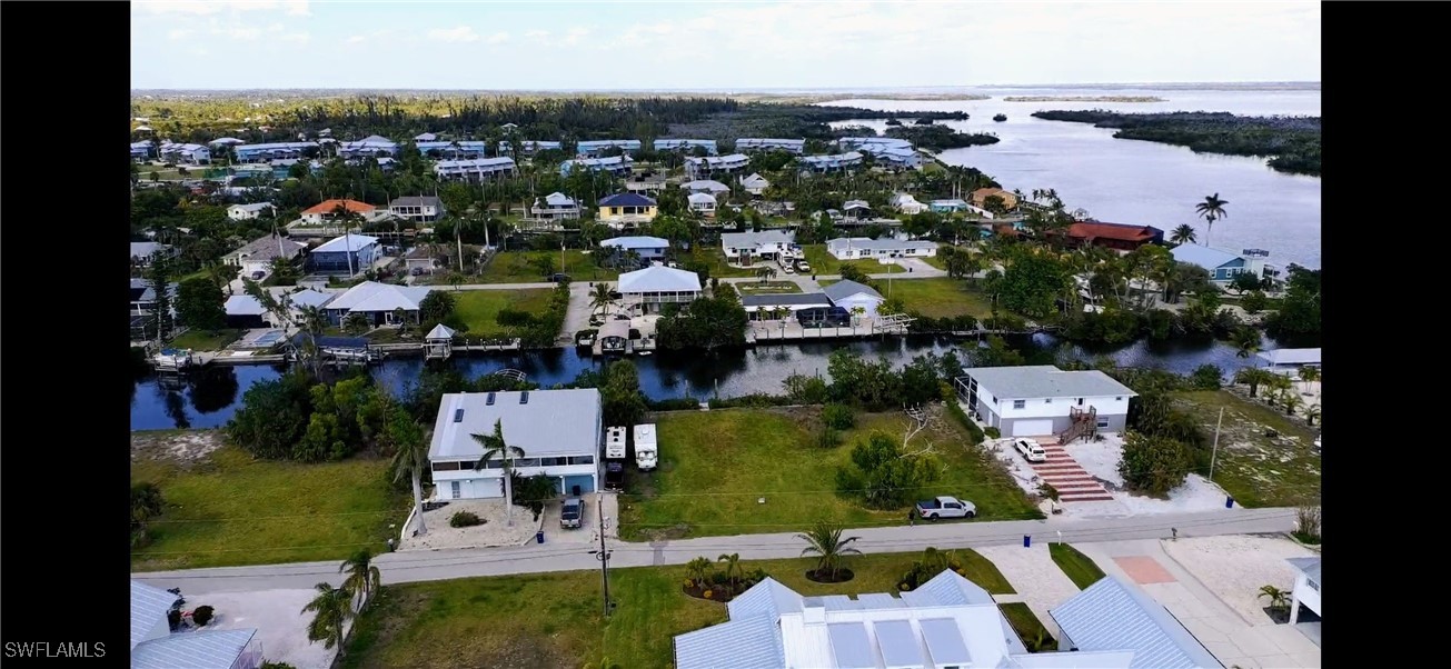 5250 Martin Cove Bokeelia, FL 33922 - Photo 5 of 7 an aerial view of multiple houses with yard