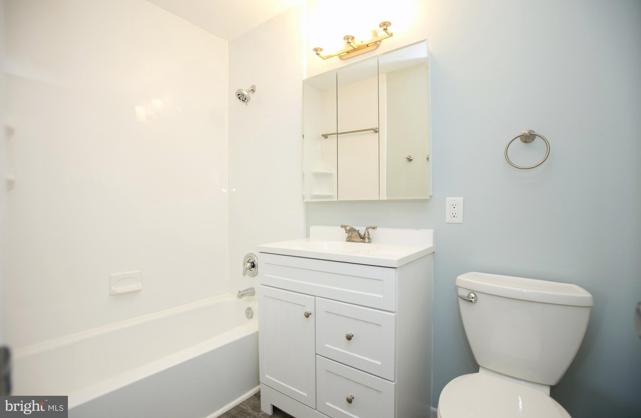 2330 Southgate Square Reston, VA 20191 - Photo 20 of 28 a bathroom with a toilet sink and mirror