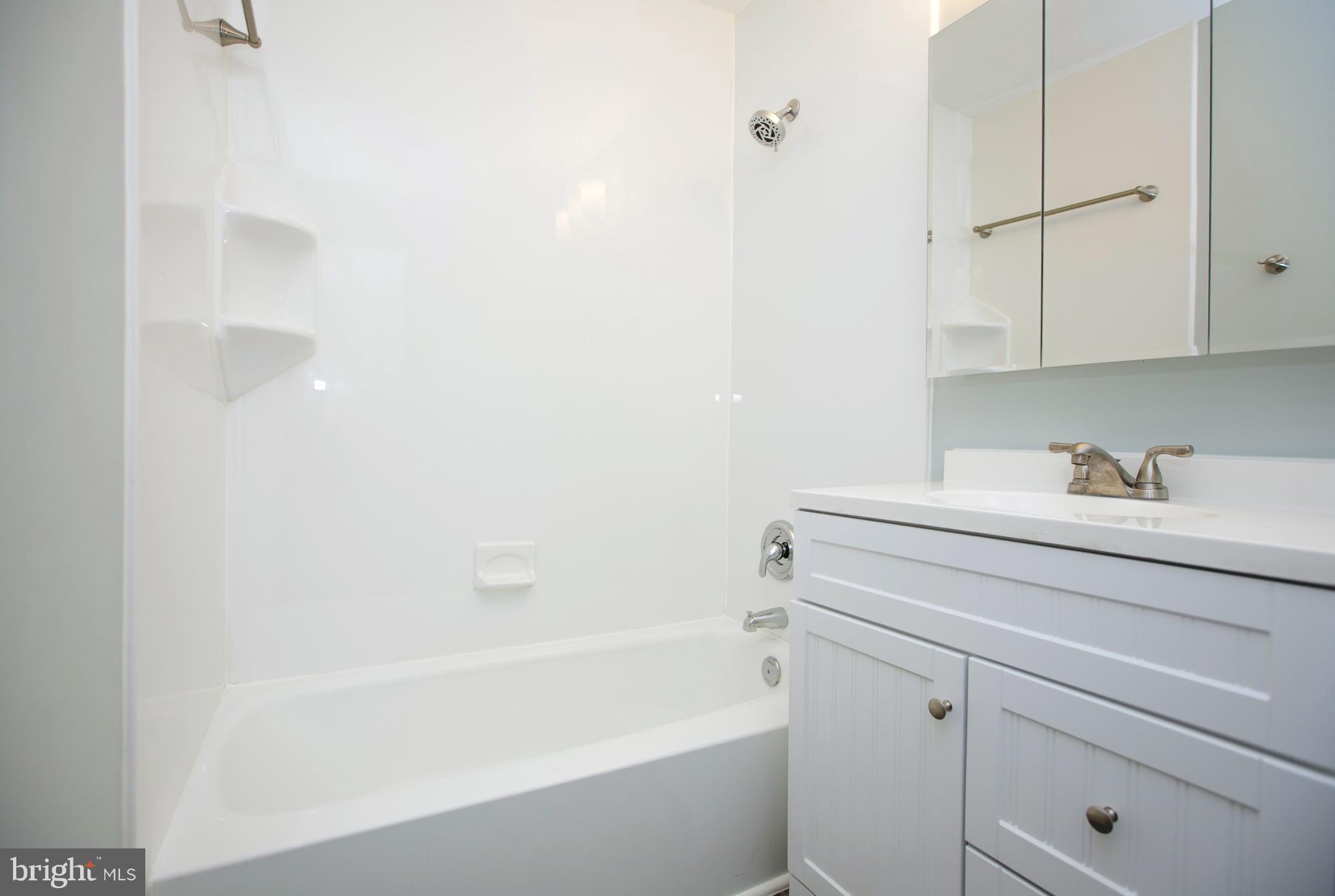 2330 Southgate Square Reston, VA 20191 - Photo 21 of 28 a bathroom with a shower toilet and sink