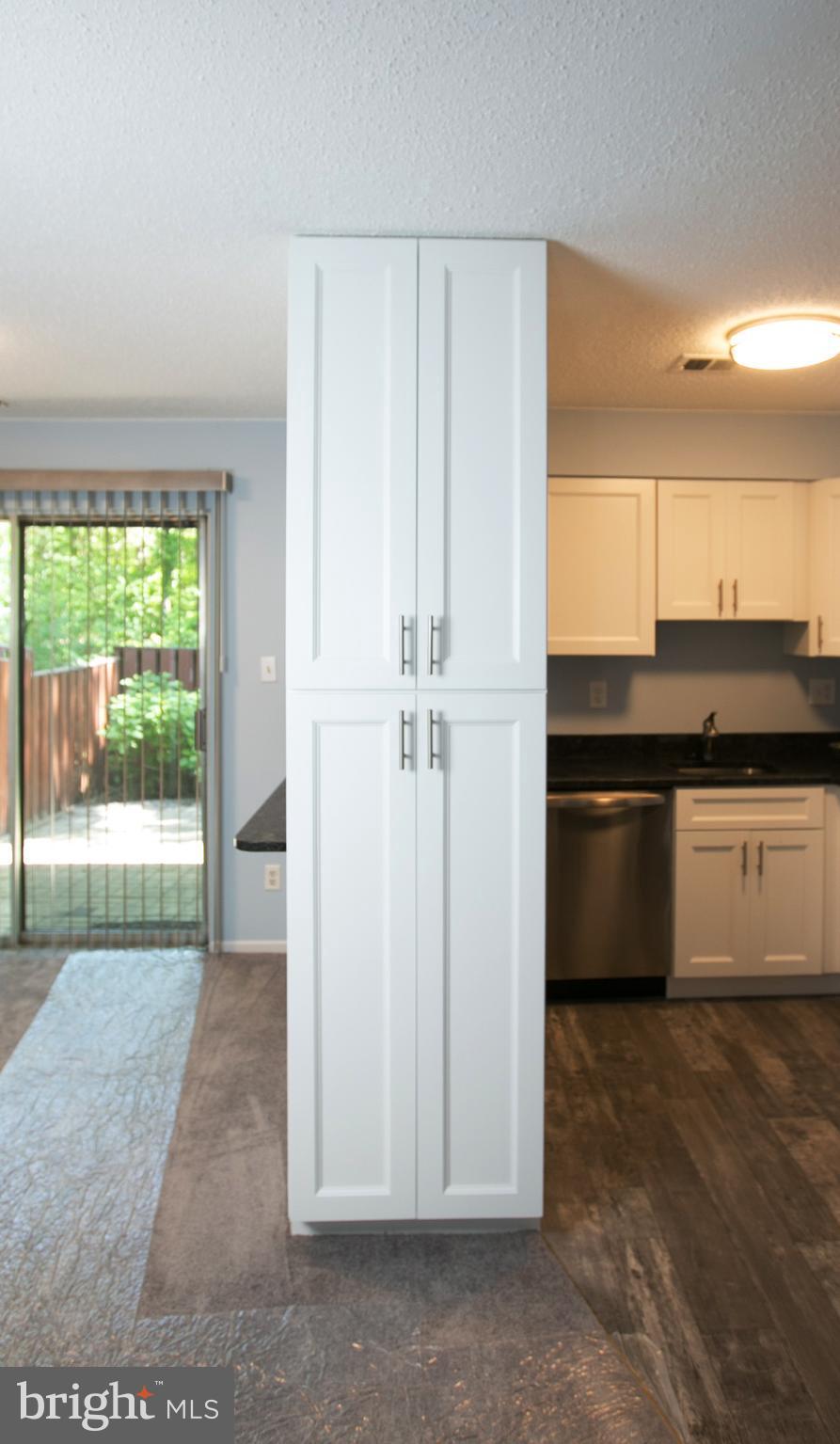 2330 Southgate Square Reston, VA 20191 - Photo 8 of 28 a kitchen with granite countertop a refrigerator and a sink