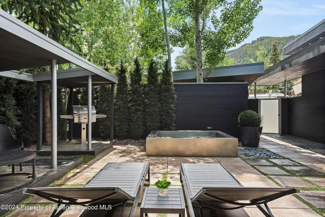 a view of backyard with outdoor seating