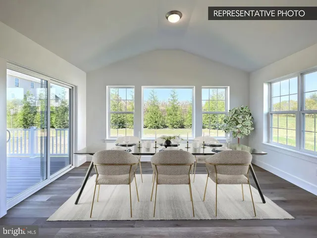 a view of kitchen with wooden floor and window