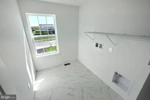 a view of a house with a yard and porch