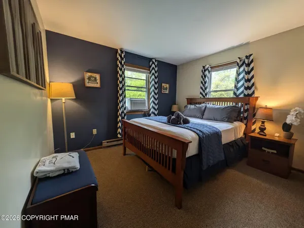 a bedroom with bed and window