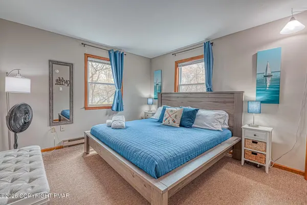 a bedroom with a bed and window