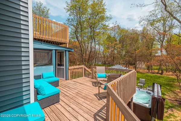 a balcony view with a seating space