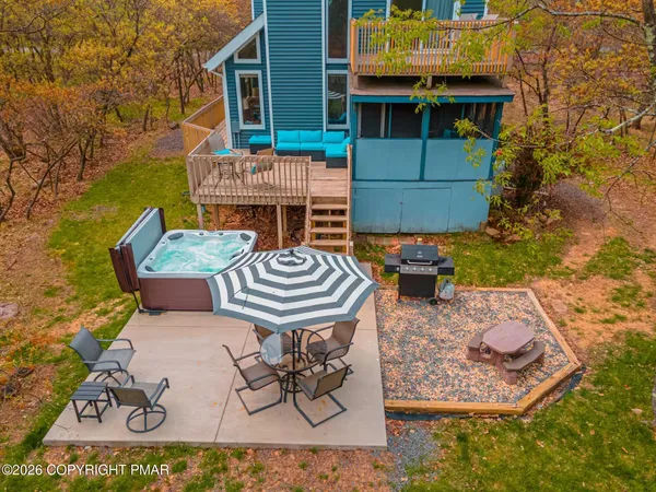 a view of an outdoor sitting area with brick walls