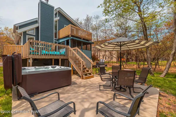 a view of house with outdoor seating space